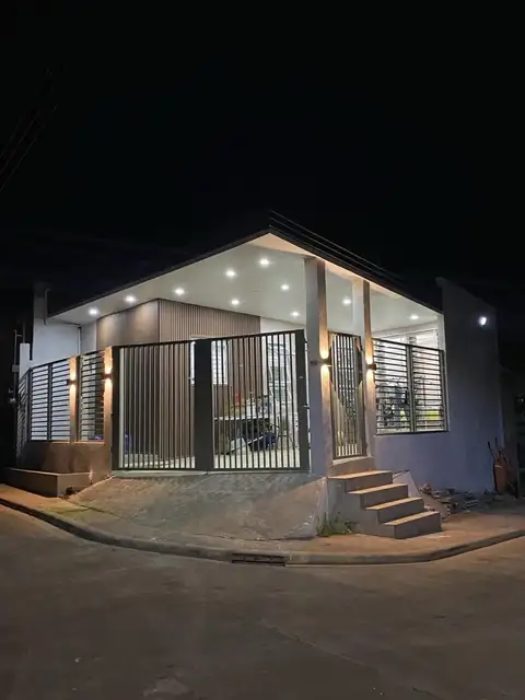 Completed single-storey residence lit at night